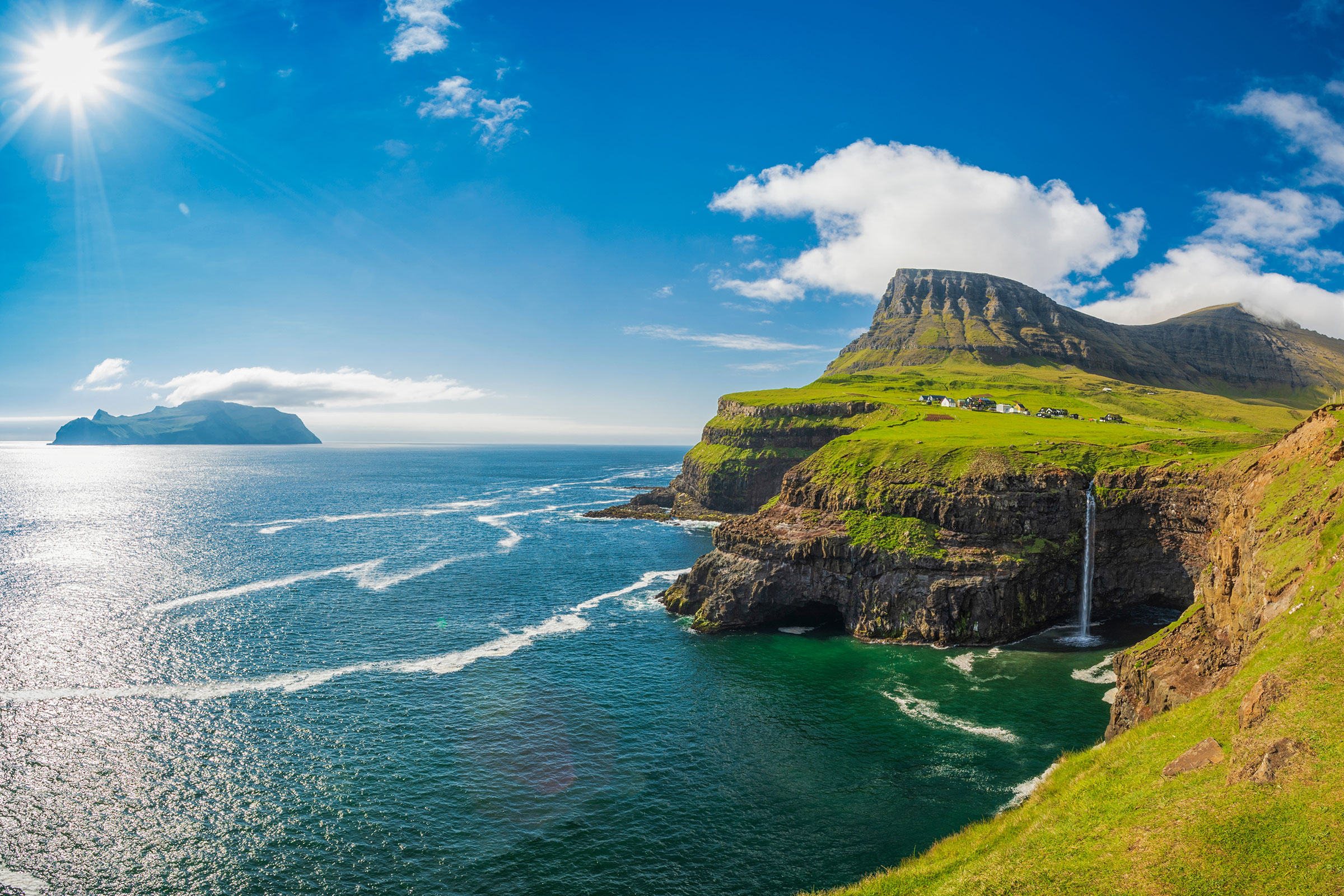 Gasadalur village and Beautiful waterfall, Sunny Day, Vagar, Faroe Islands, Denmark. 