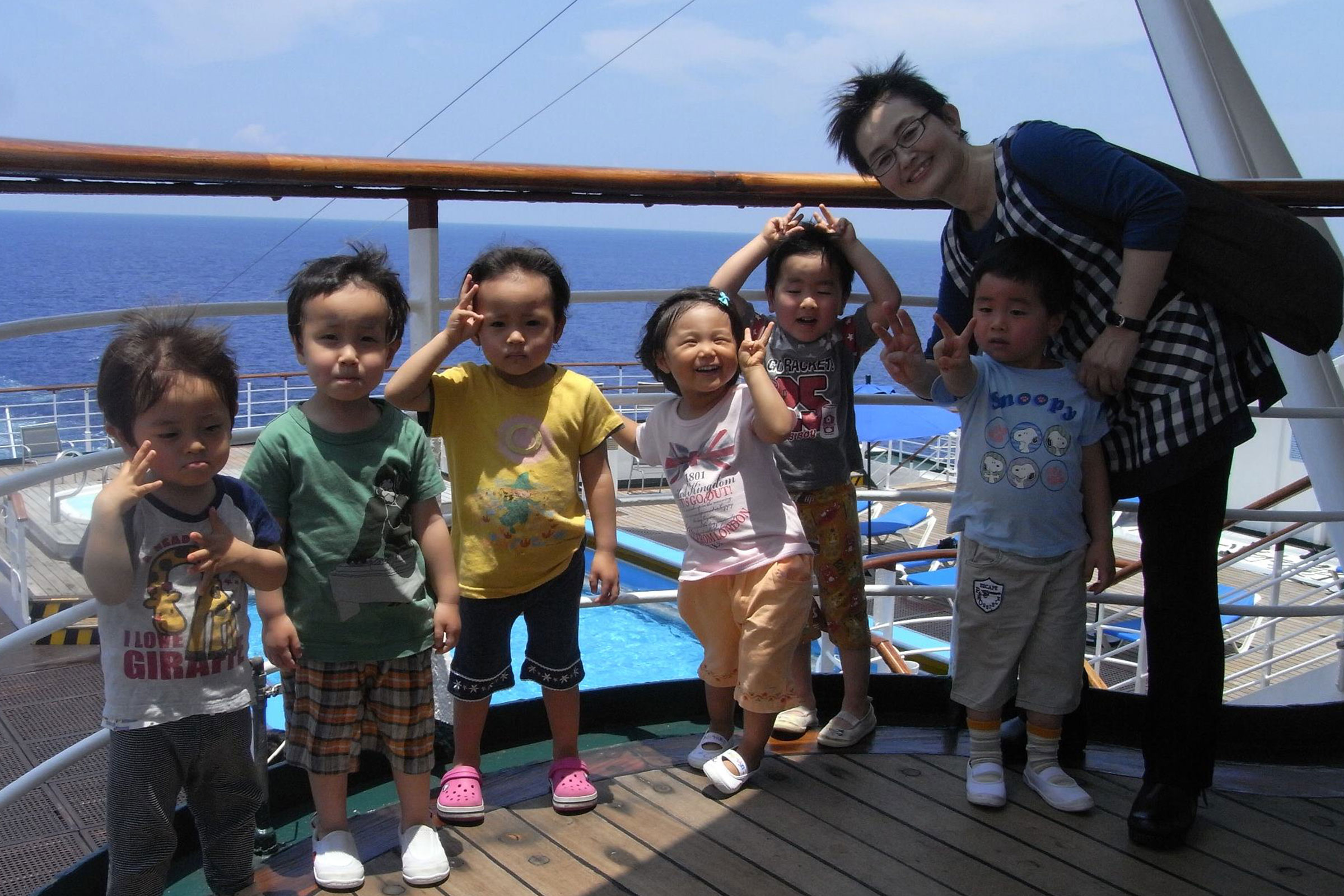 Takako Fukatsu and children on the Peace Boat
