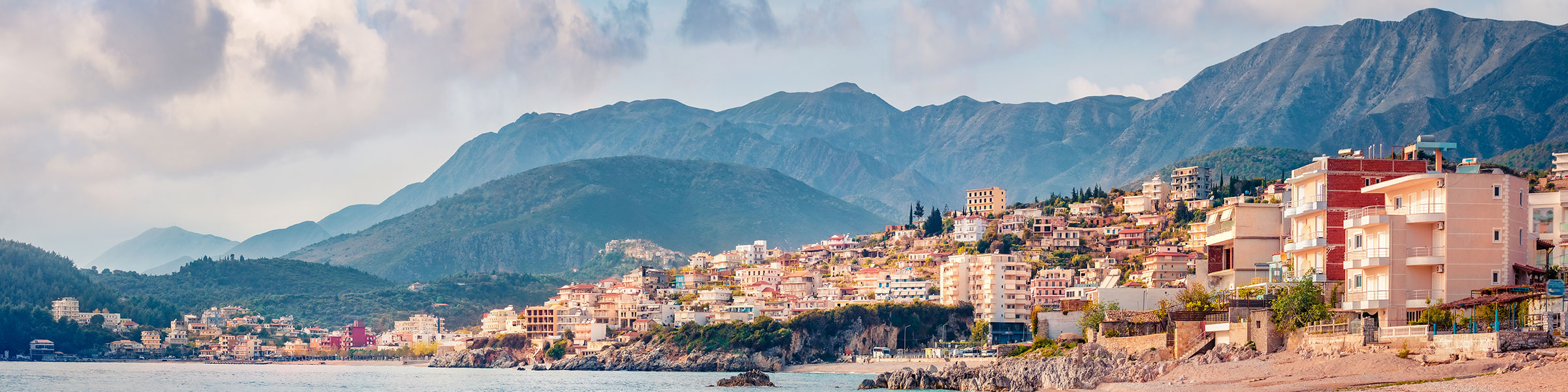 Panoramic morning view of Himare town. Stunning spring seascape of Adriatic sea, Albania.