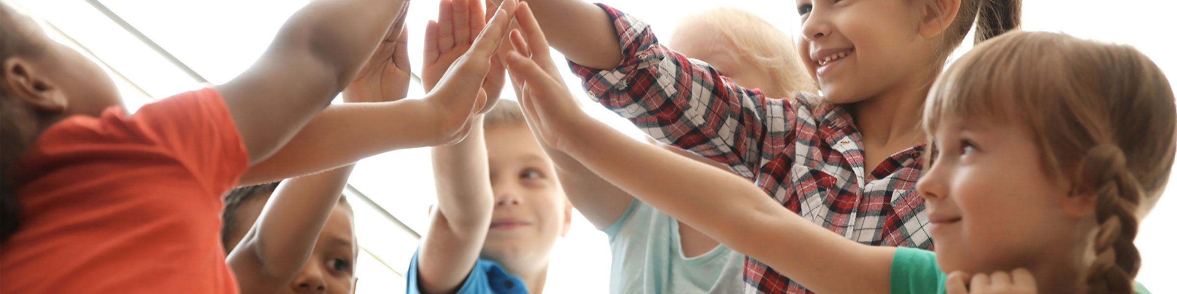 Children giving high fives