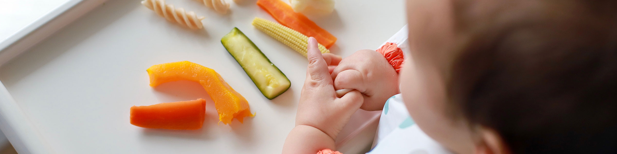 Child feeding themselves