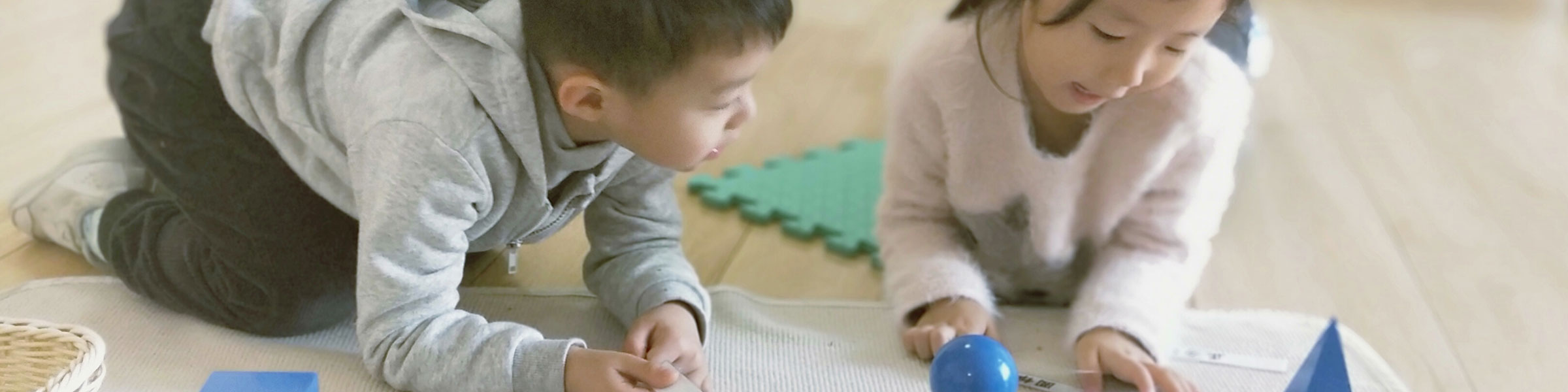 Children with geometric solids materials