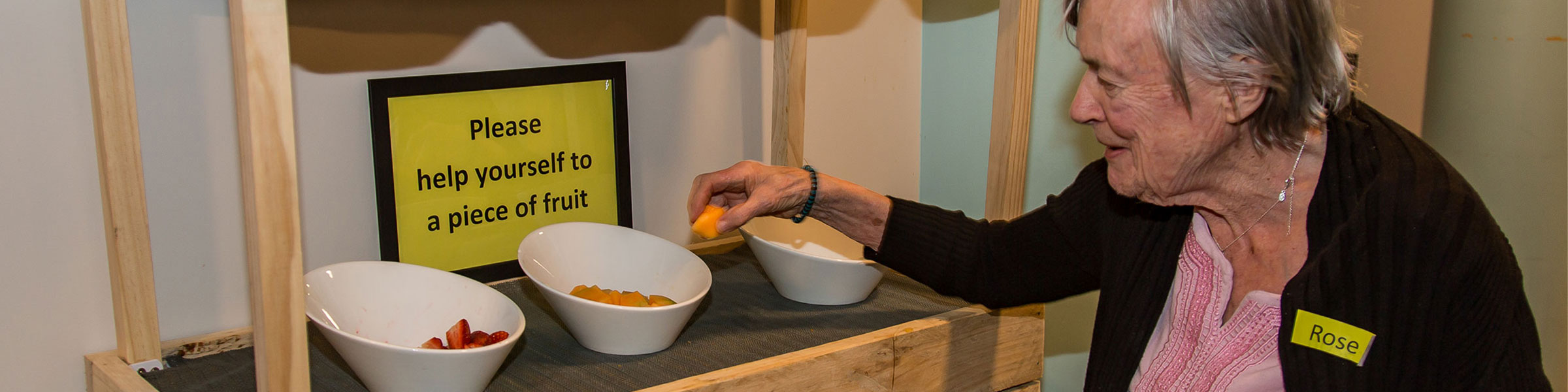 Older person choosing fruit