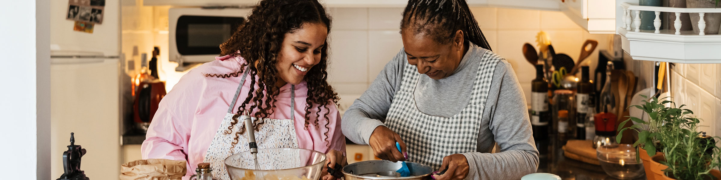 Older and younger generation cooking together