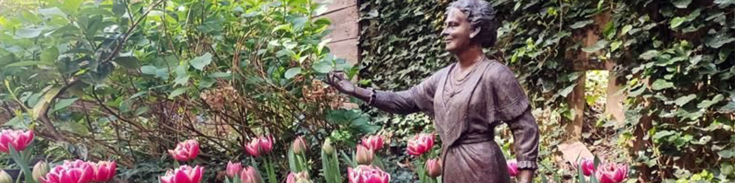 Montessori statue and tulips