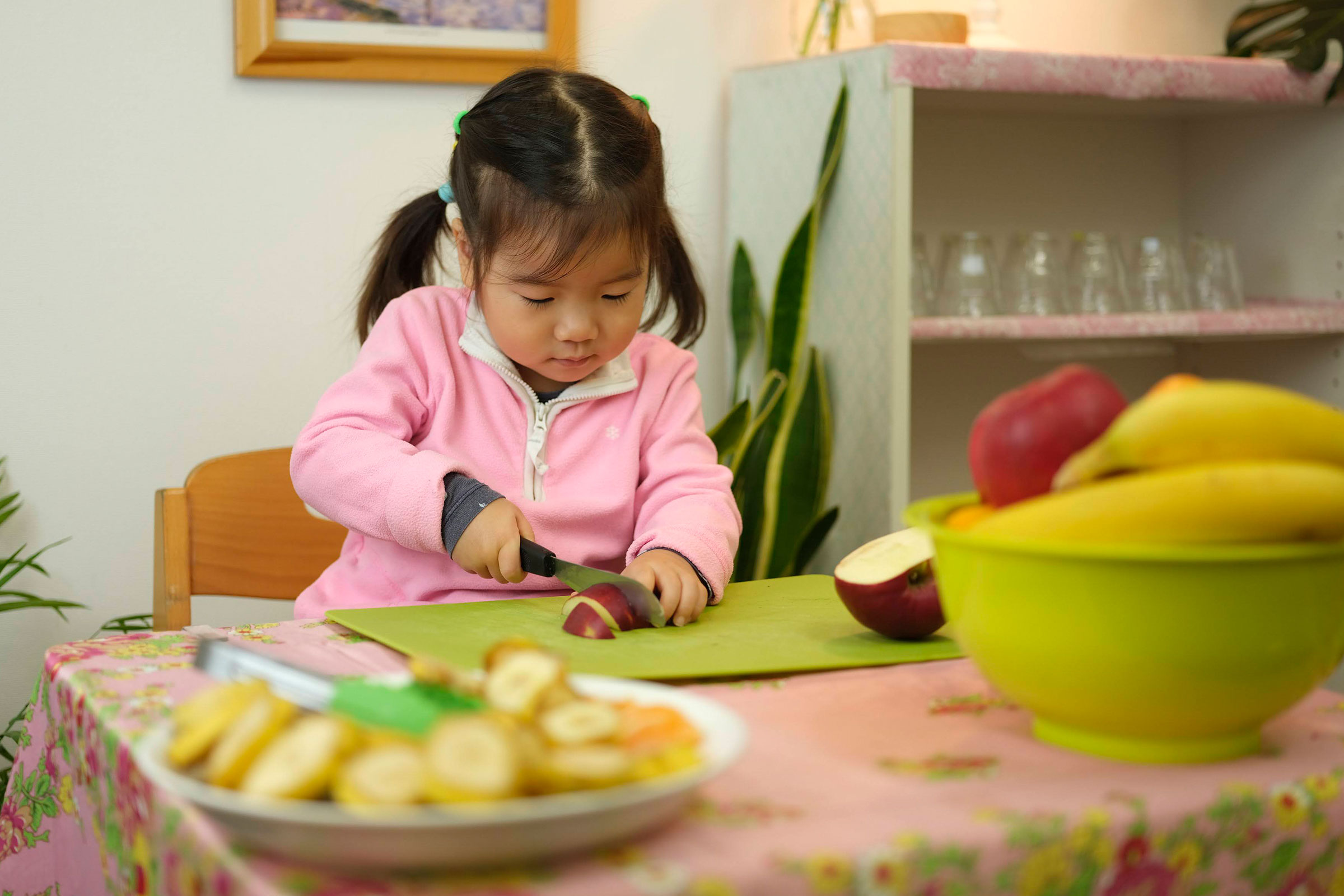 Child cutting fruit