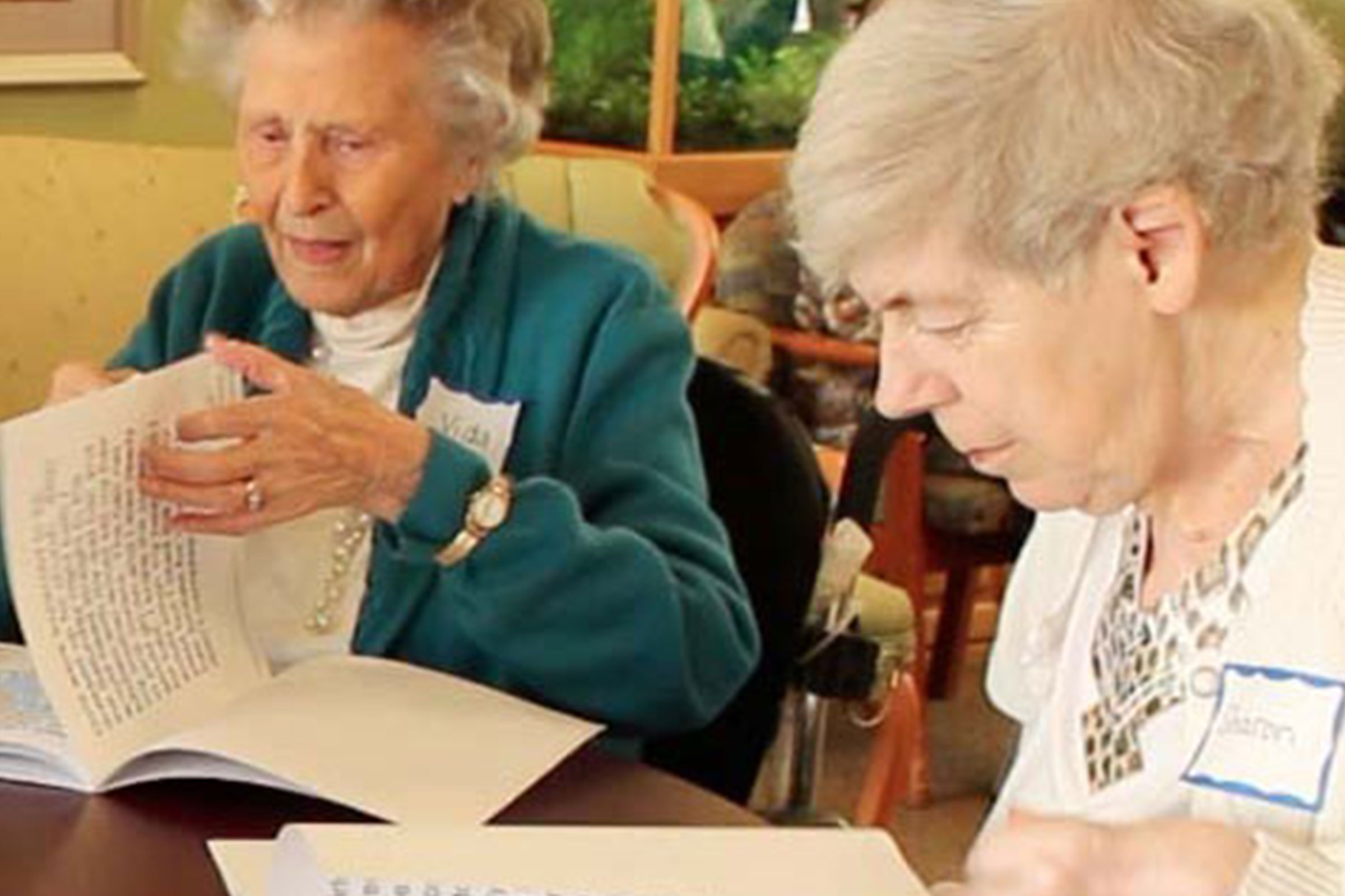 Elderly women reading