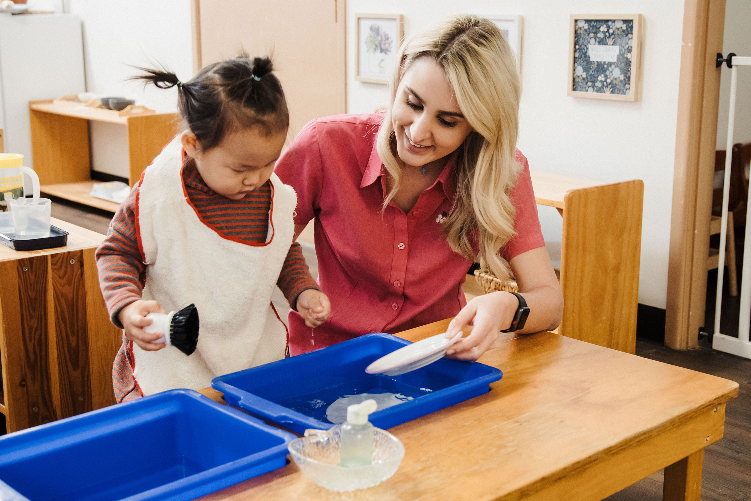 Helping child washing up