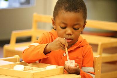 African child in Montessori classroom 