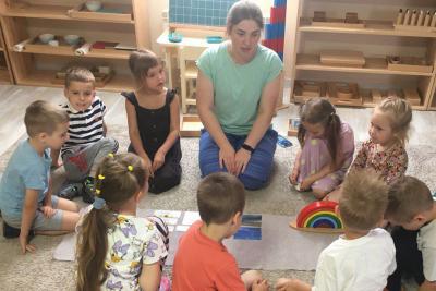 Teacher and children in a Ukrainian Montessori classroom