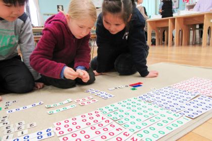 Children work on bank game