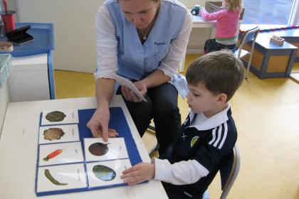 Child and teacher using Classified Cards