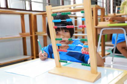 Child with abacus