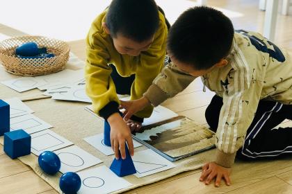 Children using geometric solids