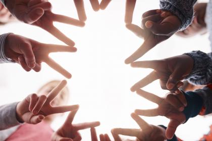 Circle of hand peace signs