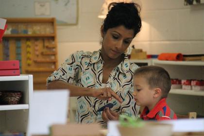 Teacher demonstrating to child